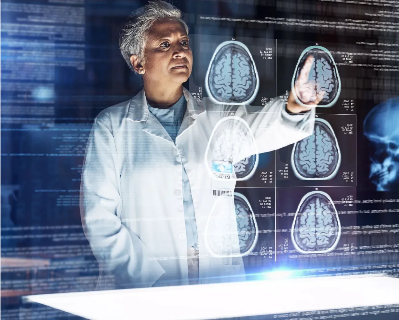 A scientist in a lab coat studying brain scans on a transparent display
