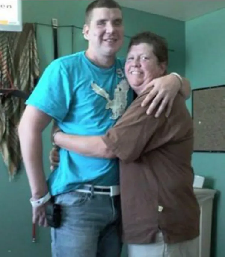 Blake hugging a woman