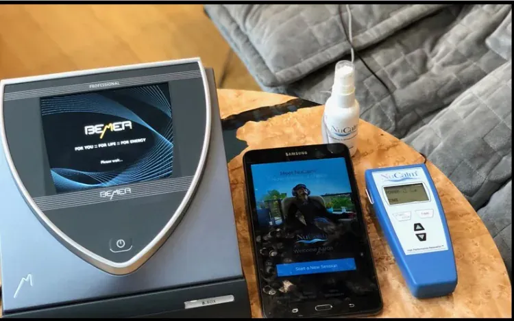 A PEMF device beside a phone and a NuCalm CES device