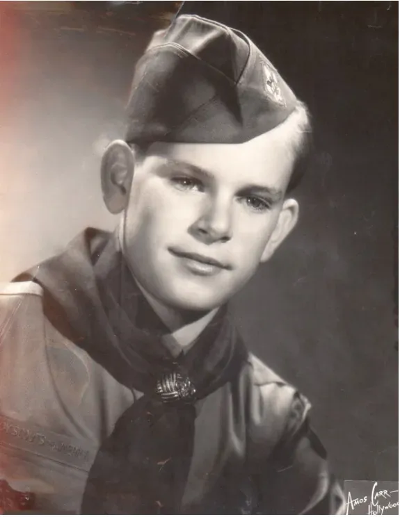 Vintage black and white portrait of a young man in a garrison cap
