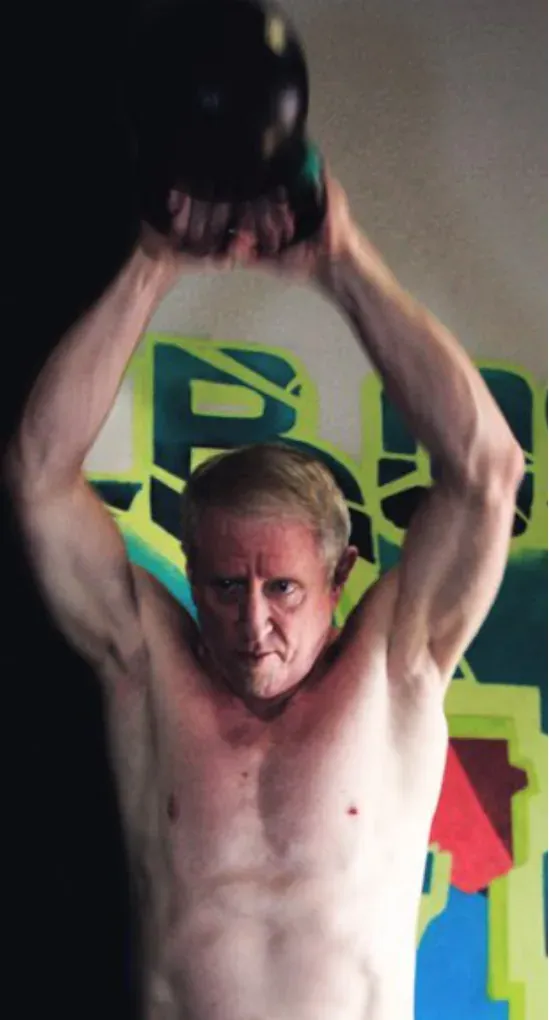 Dr. Walters lifting a kettlebell overhead