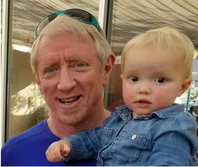 Dr. David Walters holding a young child