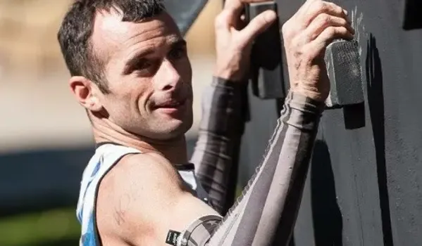 Man Climbing on Climbing Wall