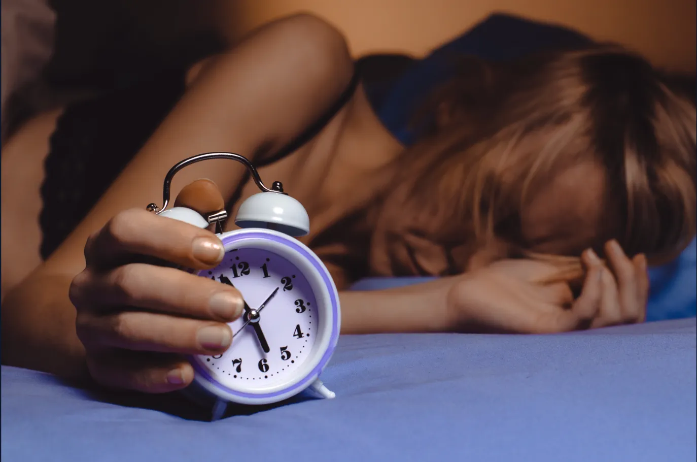 A sleeping woman holding a clock in the foreground